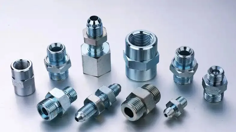 Assortment of steel hydraulic fittings — JIC, BSP and NPT adaptors and connectors