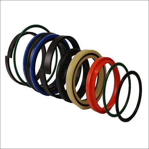 Hydraulic cylinder sealing elements — rod seals, piston seals and wiper rings laid out showing the complete cylinder seal arrangement